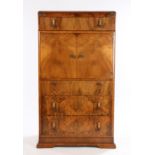 Mid 20th Century walnut veneered cabinet with frieze drawer above two cupboards opening to reveal an