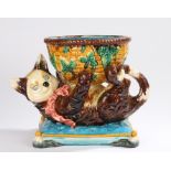 Minton style majolica jardiniere, in the form of a cat supporting a wicker effect basket with leaf