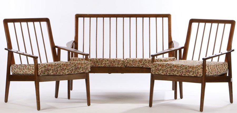 Oak veneered three piece suite, consisting of two seat settee and two armchairs, with turned spindle