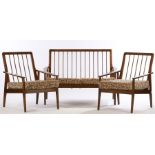 Oak veneered three piece suite, consisting of two seat settee and two armchairs, with turned spindle