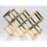 Caravell Design folding brass wine rack, with recesses for ten bottles, label to one of the