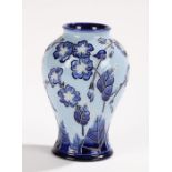 Moorcroft Florian Echo pattern vase, designed by Carole Lovatt, of bulbous form, with blue foliate