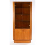 Turnidge teak corner cabinet, with smoked glass doors opening to reveal interior light and two glass