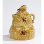 Porcelain combination milk jug and sugar bowl, in the form of a beehive, with bee form finial to the