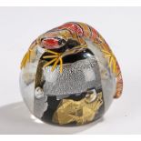 Michael James Hunter Twist Glass paperweight with millefiori lizard on a gold, silver and black
