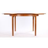 McIntosh teak circular dining table, with internal cantilever leaf, raised on oval chamfered legs,
