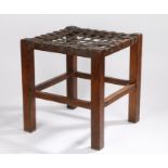 Arts and Crafts oak stool with woven leather strap seat, on square legs and chamfered stretchers. DO