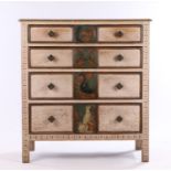 Arts and Crafts style limed oak chest of two short and three long drawers, with central carvings