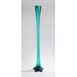 Large Art Nouveau green glass vase, of elongated form, with flared rim above a slender stem and