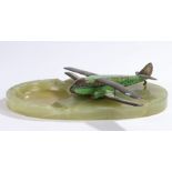 Onyx desk stand with painted metal model of a De Haviland DH 84 Dragon plane, 25cm widePlane is