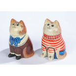 Two Joan and David De Bethel Rye pottery cats, depicted wearing a brown jacket with blue and white