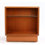 G-plan teak cube bookcase, one side with open recess and glass shelf, the rear with open recess,