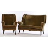 Green velvet upholstered two seat settee and armchair, with button backs, raised on turned