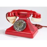 Red plastic dial telephone, with ivory effect ear and mouth piecesDial rotates but does not return