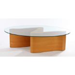 Tom Schneider coffee table, the oval glass top above a serpentine form bentwood base, the base 109cm