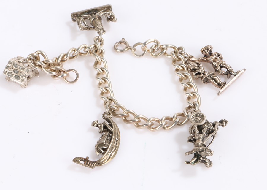 White metal charm bracelet with five Italian and other charms, 26.7g