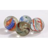 Collection of four 19th Century glass marbles, to include Latticinio core swirls, size range 22mm to
