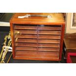 Mahogany travelling display cabinet, with carrying handle above a glazed door and interior