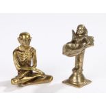 Indian brass figure, of a starving Buddha possibly Siddhartha with crossed legs, together with a