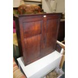 Mahogany cupboard, with paneled doors opening to reveal three adjustable interior shelves