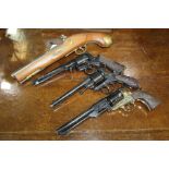 Three replica revolvers housed in original boxes, replica flintlock pistol (4)