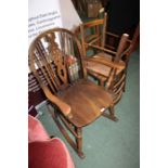 Wheel-back rocking chair, with arched cresting rail and dished seat, on turned legs, pair of bedroom