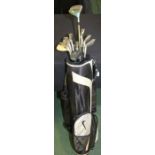 Mizuno golf clubs, consisting of a set of nine in a Nike bag, including 'Faldo' , 'Zoid' and 'MP T