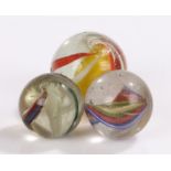 Collection of three 19th Century glass marbles, to include solid core swirls, size range 25mm to