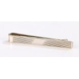 Elizabeth II silver tie clip, with banded decoration and vacant cartouche to the centre, 12.7g