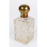 Silver and clear glass scent bottle, the orb form silver cap above a hobnail cut glass body, 15cm
