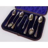 Set of six Continental white metal teaspoons, together with a pair of non-contemporary sugar tongs,