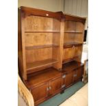 Oak open bookcase with three shelves above two panelled cupboard doors, matching oak drinks