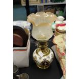 20th Century oil lamp with ceramic reservoir, brass pedestal and base, with an etched glass shade,