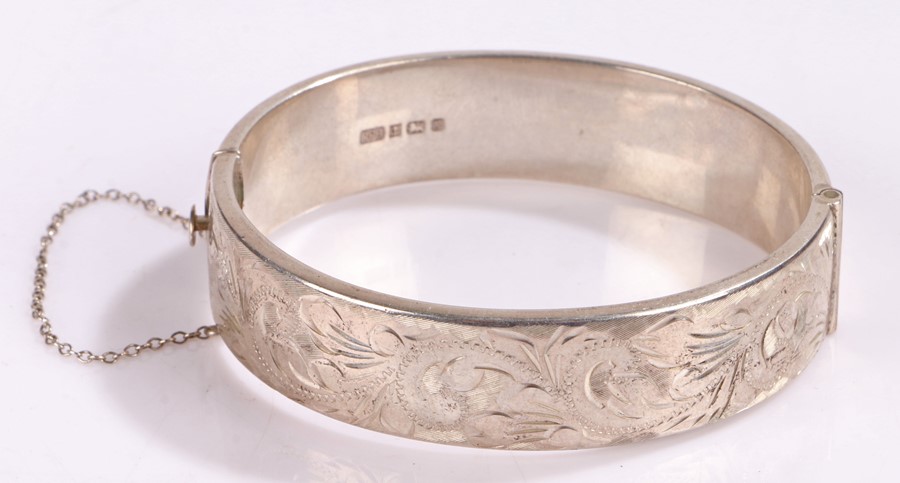 Silver bracelet, with scroll decoration and security chain, 22.8g