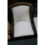 Regency style mahogany nursing chair, with scroll carved cresting rail, upholstered back and drop-in