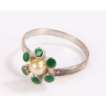 Sterling silver ring with central pearl effect bead and green enamel forming a stylised flower head,