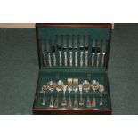 Canteen of plated shell pattern cutlery, place settings for six, housed in a green baize lined