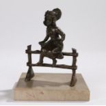 Early 20th Century French bronze depicting a young girl seated on a fence, on a marble plinth