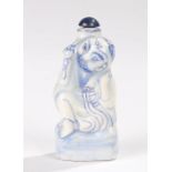 Chinese porcelain snuff bottle, 20th Century, of a figure holding a large gourd to his back with