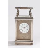 19th Century silver plated carriage clock, with reeded swing handle, the dial with Roman numerals