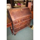 George III oak bureau, the fall opening to reveal a fitted waterfall interior with drawers and