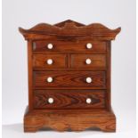 Victorian pitch pine miniature chest, with concealed compartment to the top, the shaped pediment