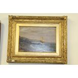 Coastal scene with figure on a beach and distant boats, oil on canvas, housed in a gilt frame, the