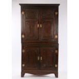 19th Century oak standing corner cabinet, the concave cornice above a pair of fielded panel doors
