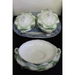 Three Alfred Meakin porcelain tureens, decorated with green foliage and gold accents, marked '