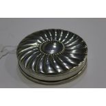 Sterling silver compact, with swirled gadrooned exterior and interior with mirror to the lid,