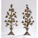 Pair of gilt metal foliate and leaf decorated candelabra, the tapering candelabra five sconces above