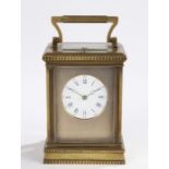French late 19th Century brass carriage clock, of larger proportions, with a five bevelled glass