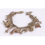 Silver charm bracelet, with seventeen charms, 53.6g