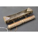 Copper and brass incense burner, of dished form with holes to each end and lettering to the